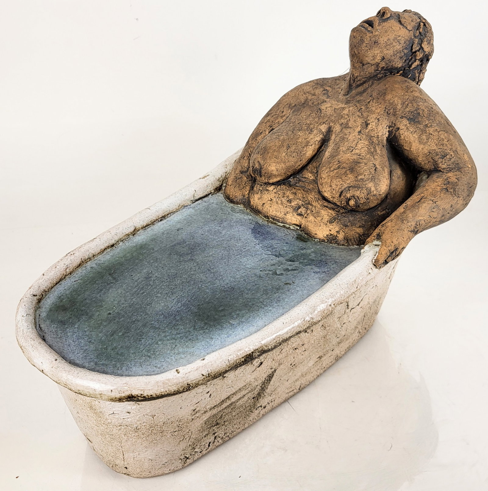 Jiri POSVA: Erotic Sculpture of Woman in Tub: Sculpture of a woman in a tub, stamped by Jiri Posva (Czechoslovkian, b. 1948). Provenance: From the Collection of Brendelle & Fred Walden. [12 1/2" H x 16 1/2" W x 9 1/2" D]. Overall good condition.