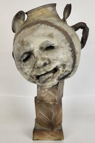 Sculpture of a Man's Face on a Moon