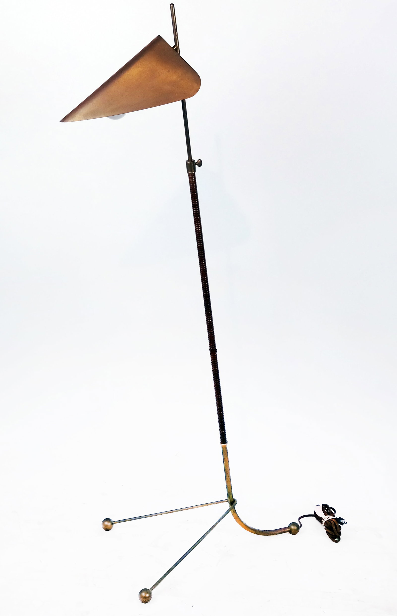 Aerin Moresby Antiqued Brass Floor Lamp: An Aerin Moresby antiqued brass floor lamp. Provenance: From the Collection of Brendelle & Fred Walden. [55 1/2" H; Base: 22" H x 14 1/2" W]. Good, used condition.