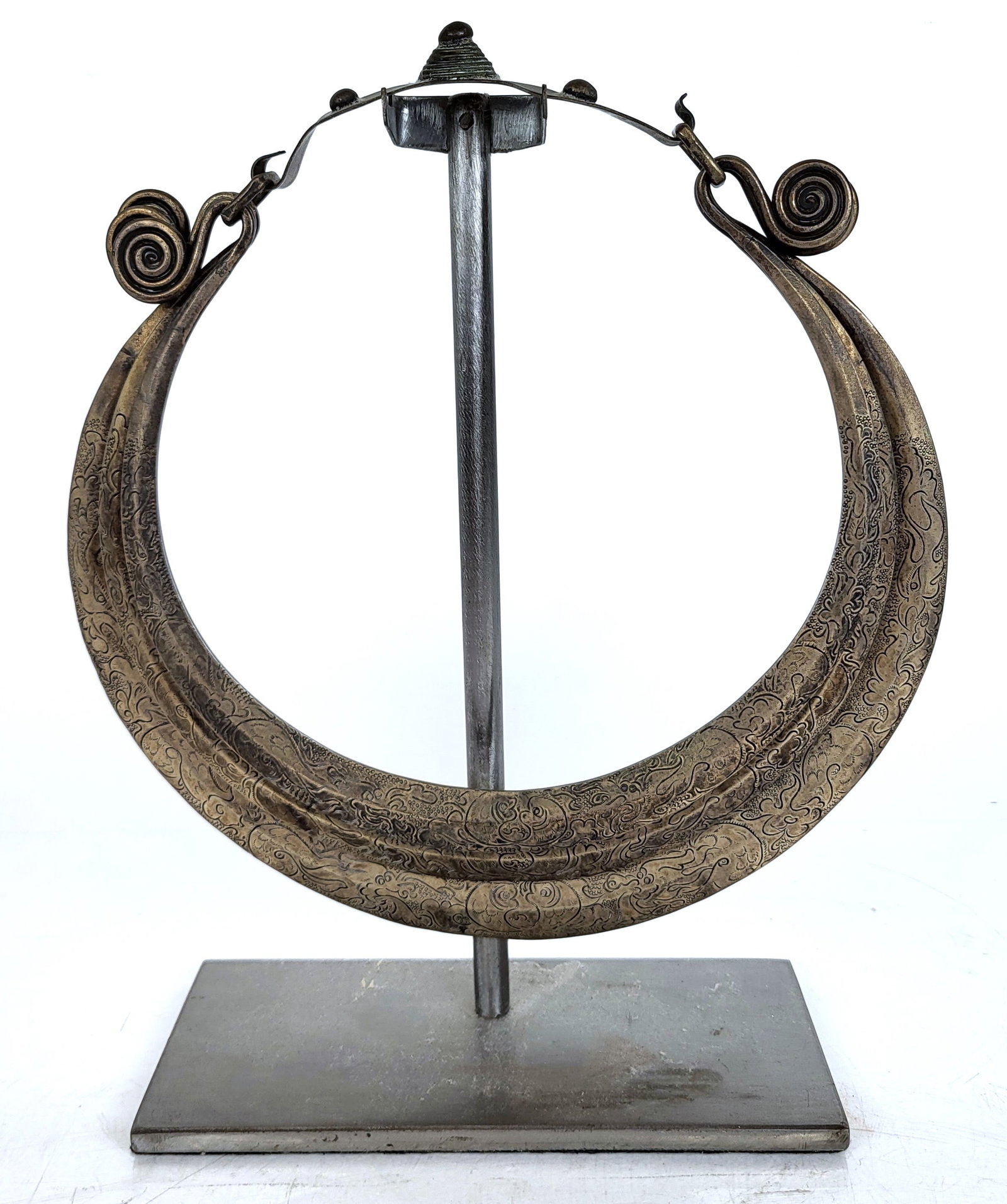 Antique Metal African-Maio Tribal Necklace: Antique metal African-Maio Tribal ceremonial choker necklace. Provenance: From the Collection of Brendelle & Fred Walden. [Necklace: 9" H x 8 1/2" W; Overall with stand: 10 1/2" H x 7" W x 3" D]. In g