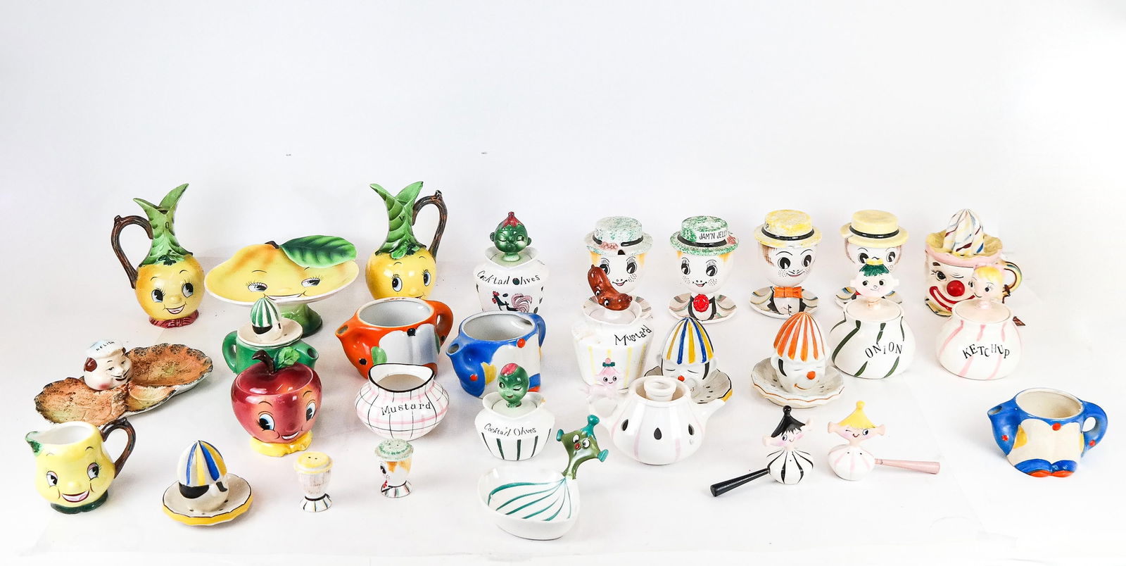 Mixed Group of 36 Hand-Painted Japanese Serveware: Group include: a 9-piece set by Lego, Japan; mixed 16-piece set by ESD, Japan; mixed 4-piece set by PY, Japan; 6 juicer reamer cups, and one condiments plate. Mid-20th century. [Largest: 8" H x 4" W x