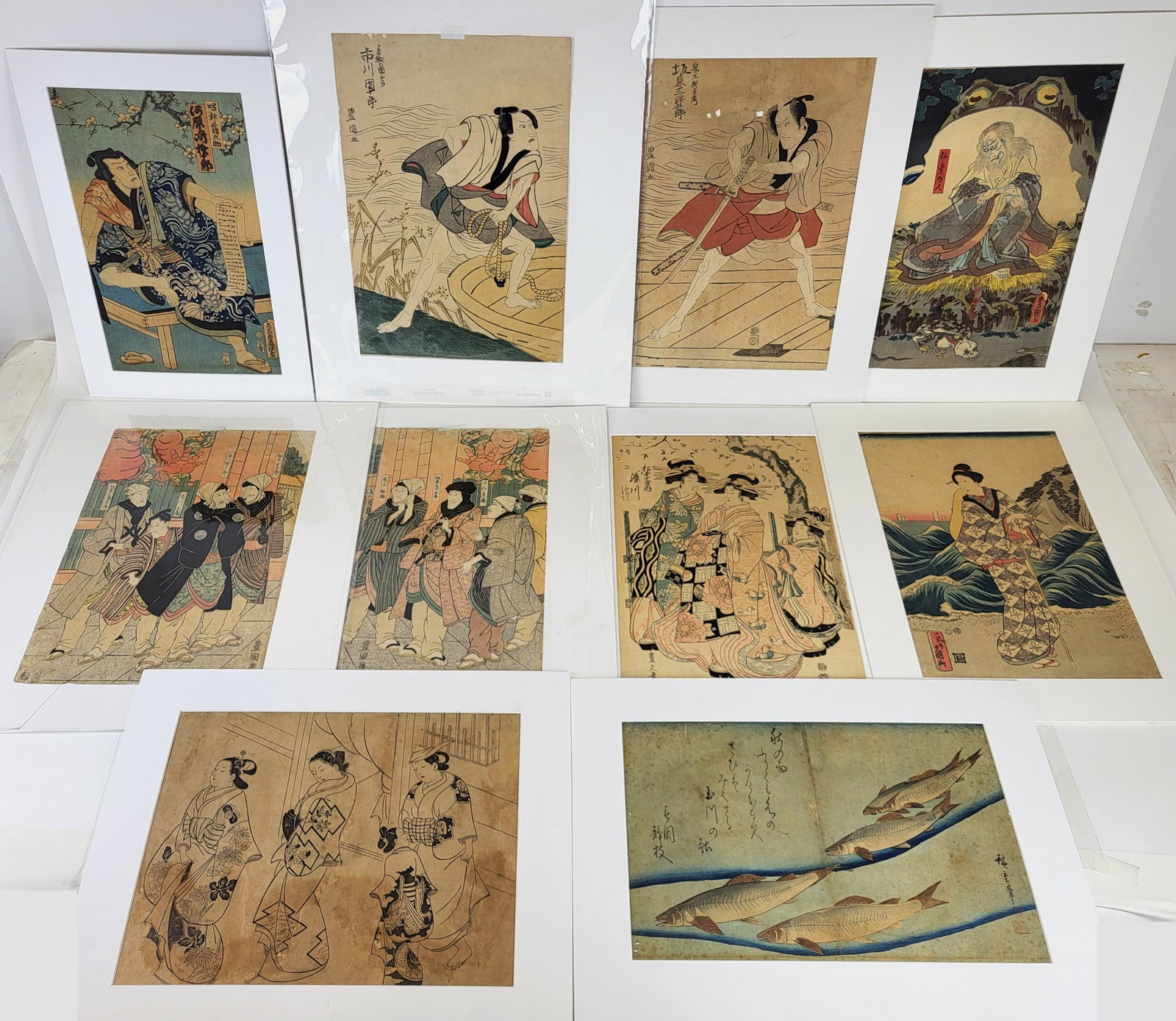 Group of 10 Ukiyo-E Woodcut Engravings: Group of ten (10) woodcut 18th19th century engravings on rice paper by Utagawa Kunisada, Katsukuna Shun'E, Utagawa Hiroshige and others, all matted and tipped at top edge to archival mounts. [Largest:
