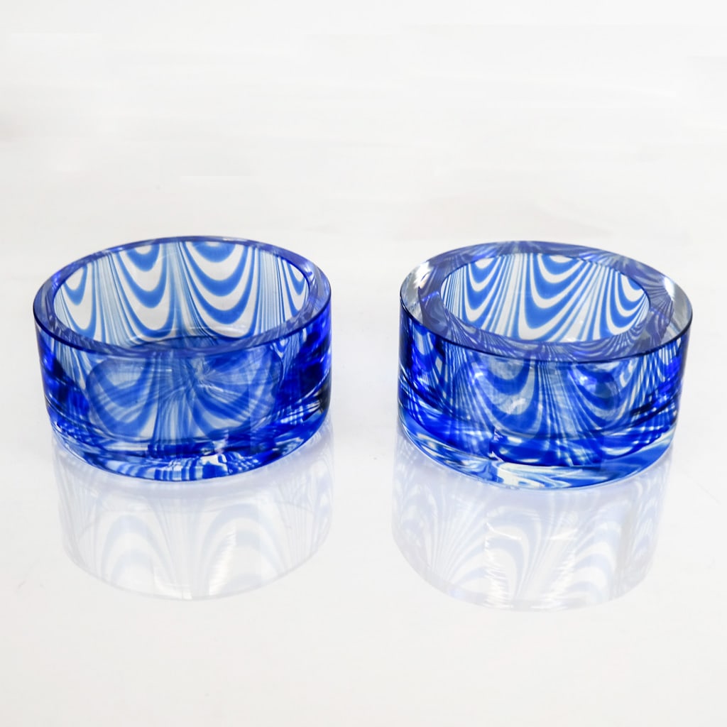 Gino Cenedese Murano Art Glass Coasters (2): Pair of Gino Cenedese Murano art glass wine coasters with cobalt blue feathered design, 1985, marked to base. [1 1/4" H x 4 7/8" Diam.]. In overall good condition. Condition reports and requests for a