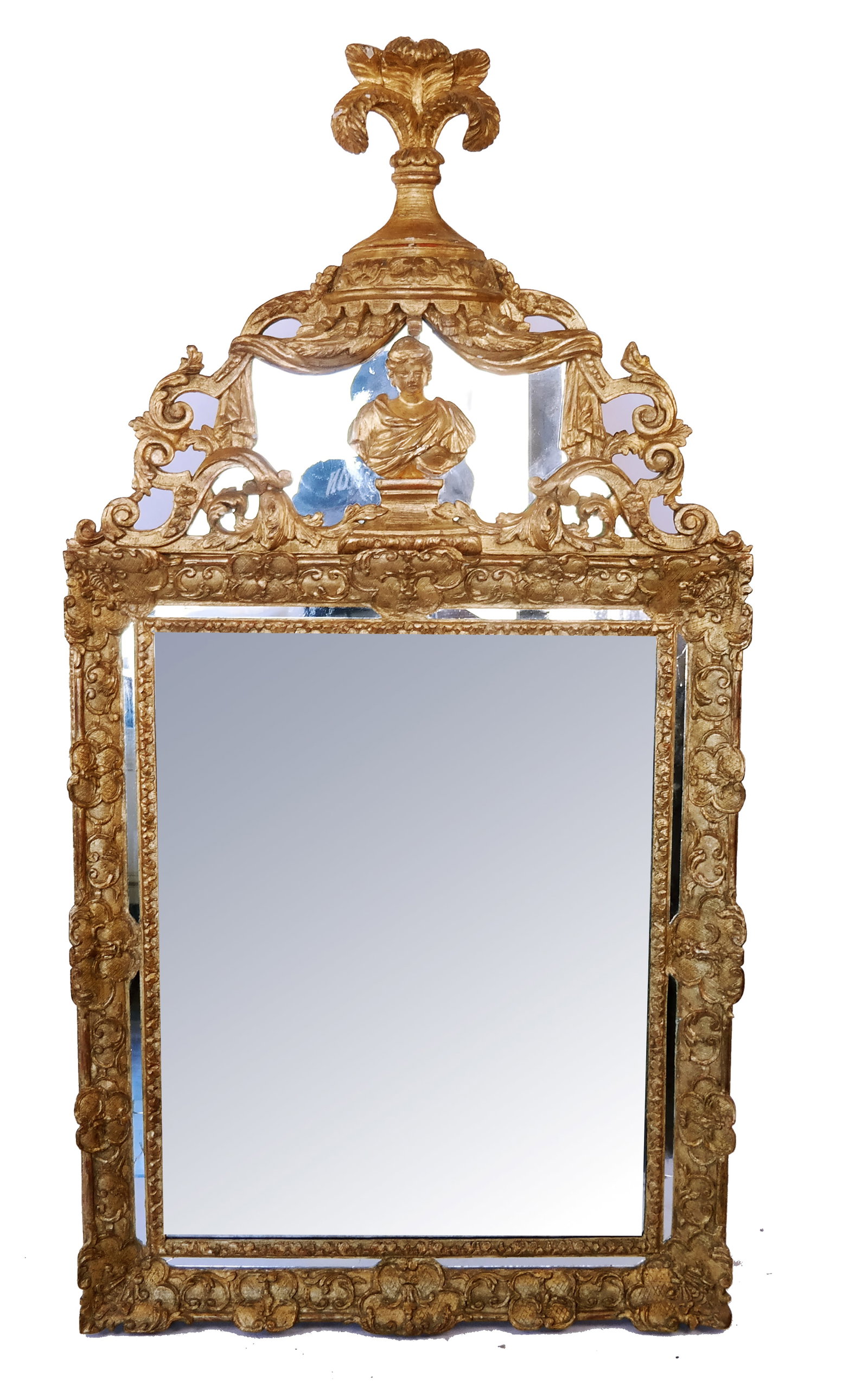 Gilt Carved Regence Mirror: A gilt carved Regence mirror, late 18th-early 19th century, showcasing a cartouche containing an allegorical figure set in an ornately carved drapery form enclave with tassels, with vasi-form flower f