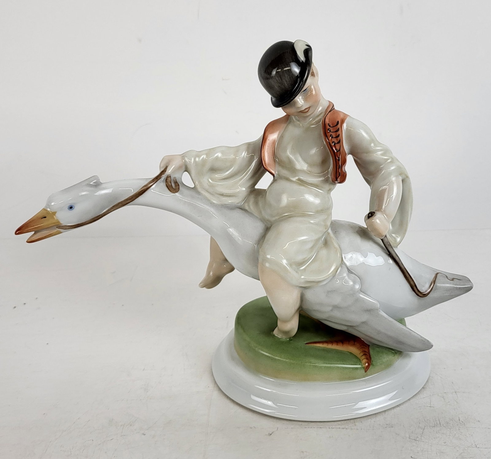 Herend Hand-Painted Sculpture: Herend (Hungary) hand-painted porcelain sculpture, "Mattie and the Goose". [8 1/4" H x 4 1/2" W x 10 1/2" D]. Condition reports and requests for additional photos cannot be accepted on this lot; pleas