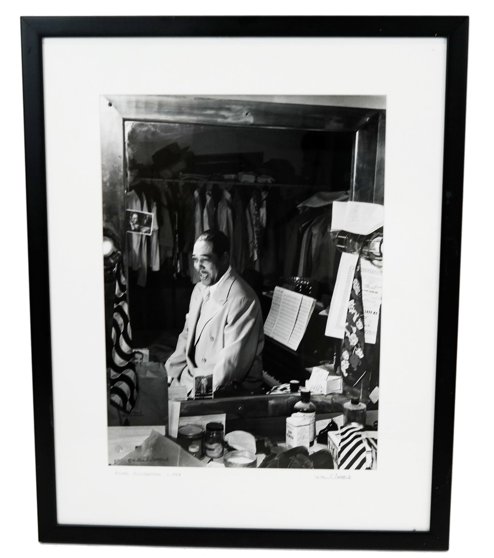 William GOTTLIEB: Duke Ellington - Photograph: Silver gelatin print photograph of Duke Ellington in a seated 1/2 profile dressing room pose, signed at bottom left "c[copyright] William Gottlieb" in felt top pen and again on the matte in pencil, al