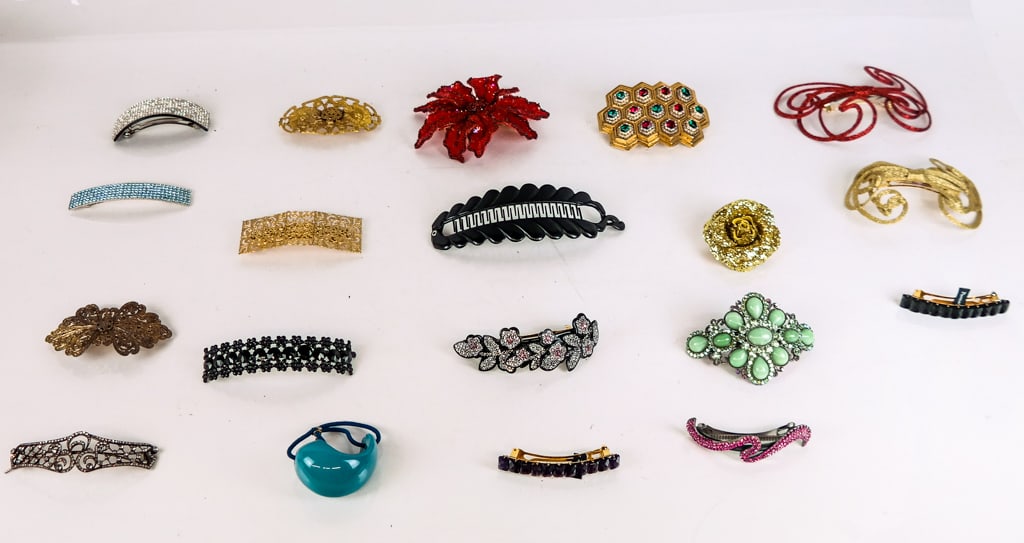 Collection of Hair Accessories and Combs (40): Collection of hair accessories and combs, comprising a wide assortment of hair combs and barrettes, variously designed and decorated with crystal, feathers, gilt metal work, etc., including a Robert f