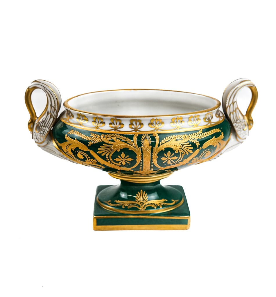 Paris Porcelain Swan-Handled Urn: A green with white trim and gilt overlay oval urn with swan-form handles, bearing hallmark verso. [6" H x 9" W x 4" D]. In good condition. Condition reports and requests for additional photos cannot b