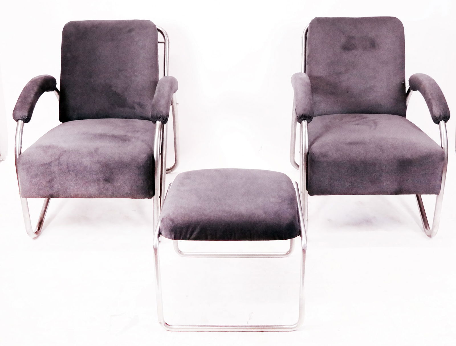 Anton Lorenz Thonet Chairs & Ottoman: Anton Lorenz Thonet Art Deco tubular steel armchairs and matching ottoman, 1931. [Chair: 37.5" H x 27" W x 33.5" D; 18.5" H to seat; Ottoman: 18" H x 21" W x 20" D]. In overall very good condition, wi