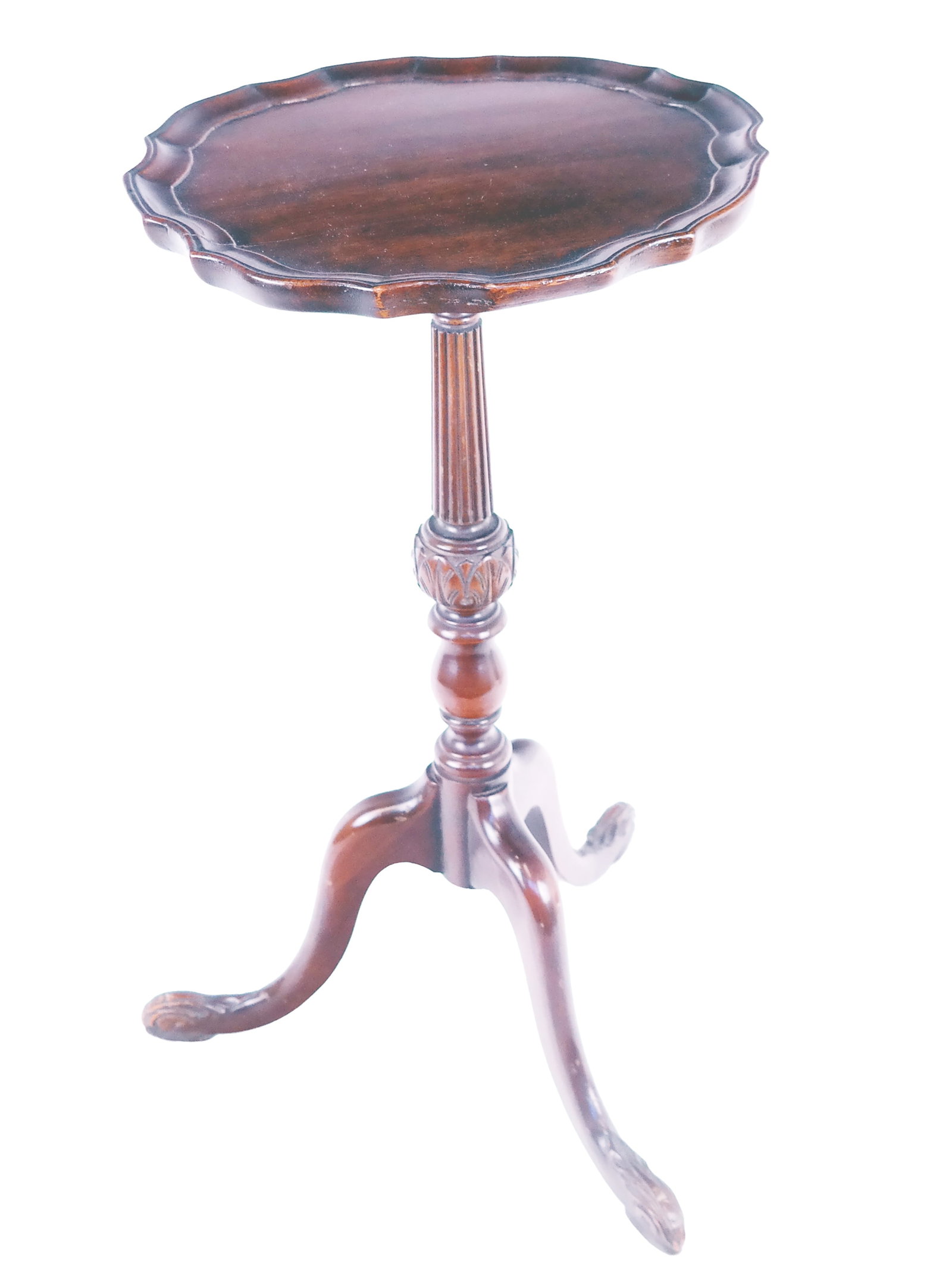 Mahogany Piecrust Candlestand: Tripod mahogany candlestand, American, 20th century, with piecrust top and carved pedestal base. [22.25" H x 14" diameter]. In fair condition, with some warping to top. Condition reports and requests 