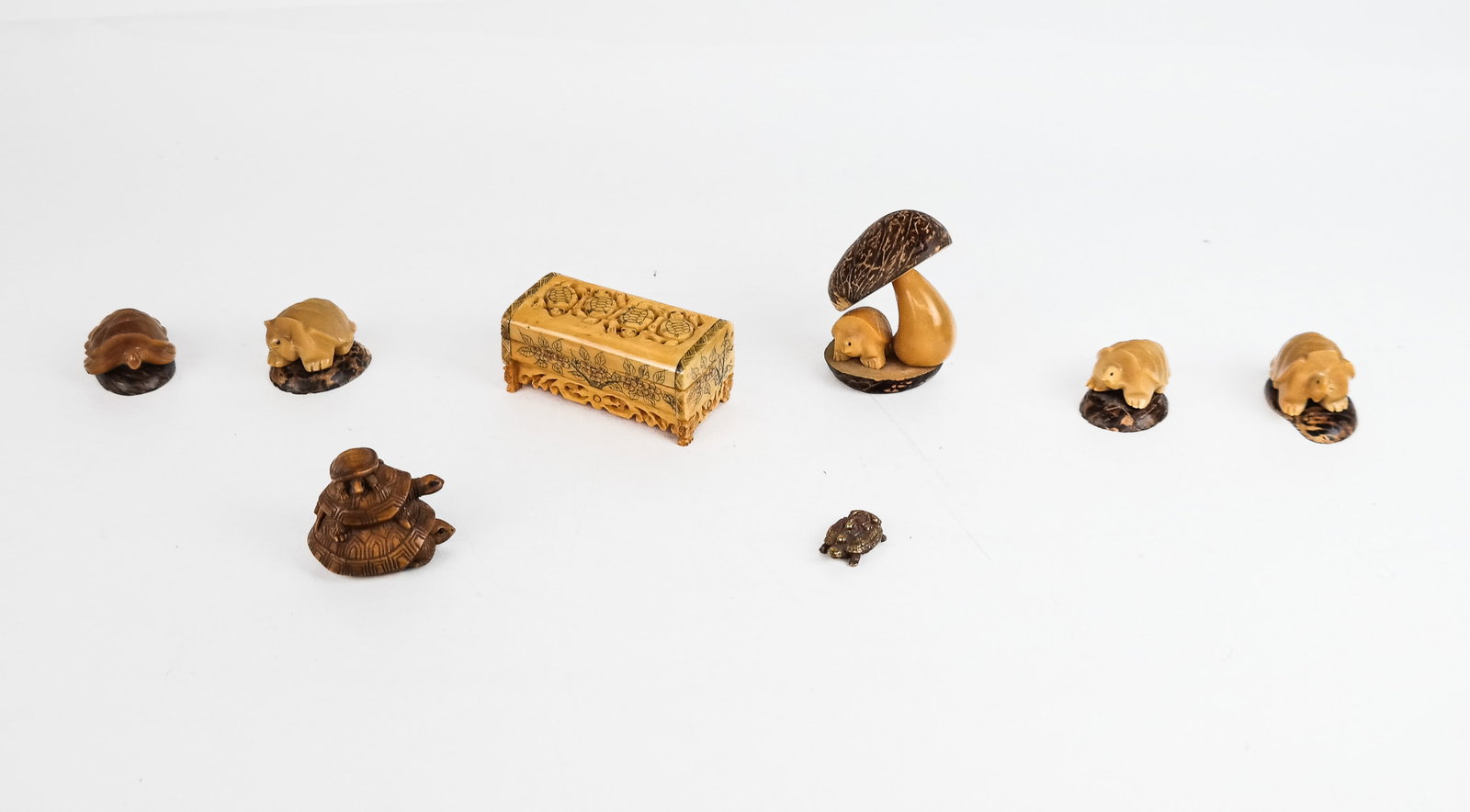 Group of Carved Turtle Decorate Accessories (8): Group of carved resin, bone, metal and wood turtle decorated accessories comprising 1 box, and 7 small figures