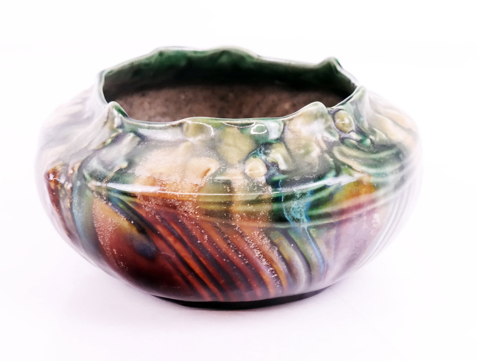 Faiencerie Thulan Jardiniere: Early 20th century, likely 1920s, majolica drip glaze jardiniere, from Faiencerie Thulan (Belgium), with foliate design, marked on base. [3 1/2" H x 7 1/4" Diam.]. In overall good condition, with a sm