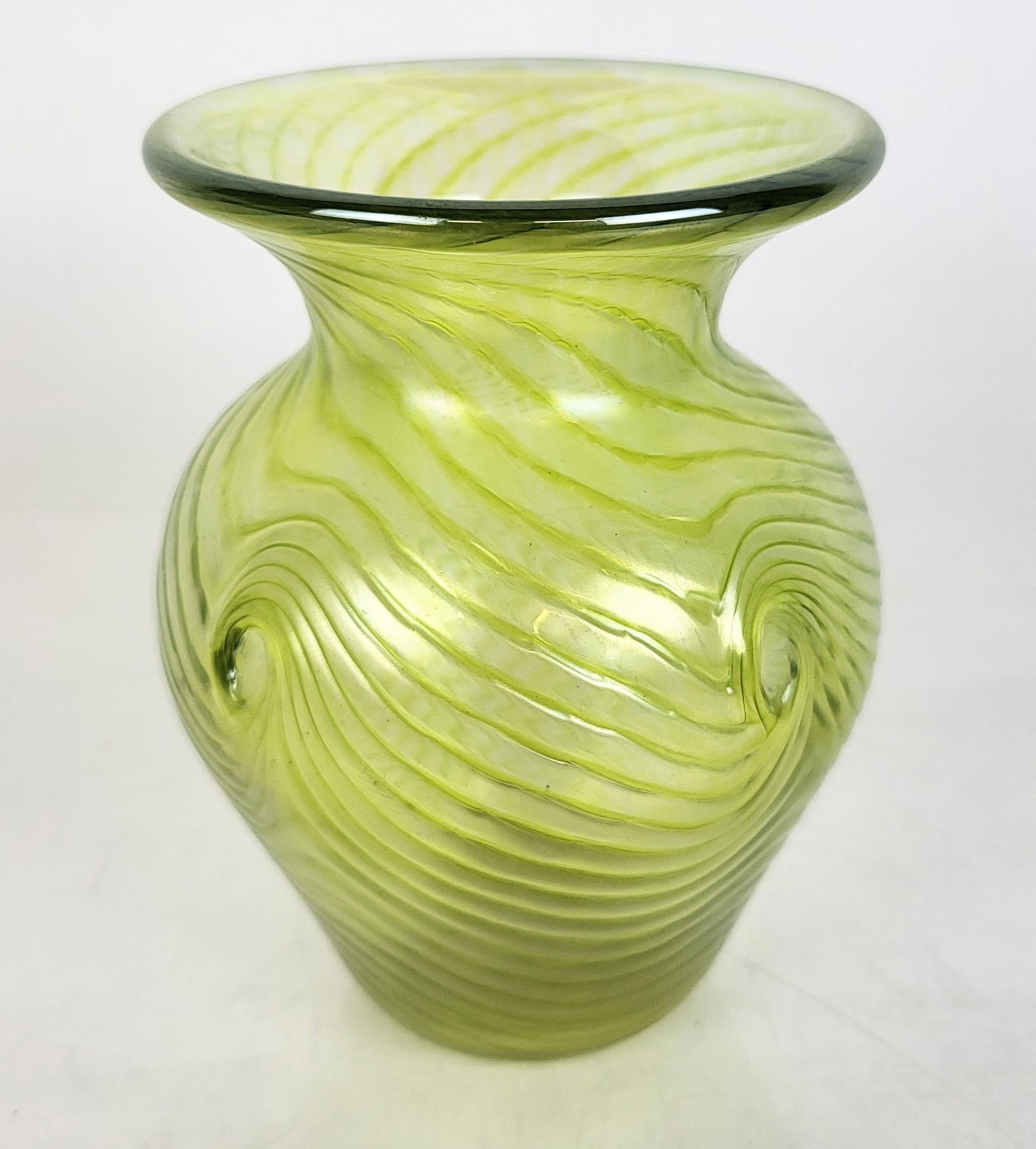 Loetz-Type Art Nouveau Vase: Art Nouveau art glass vase in the Loetz style, with iridescent glass and radiating spirals, hand-made with polished pontil mark. [5 1/4" H x 4" W]. In good condition, with no chips or cracks. Conditio