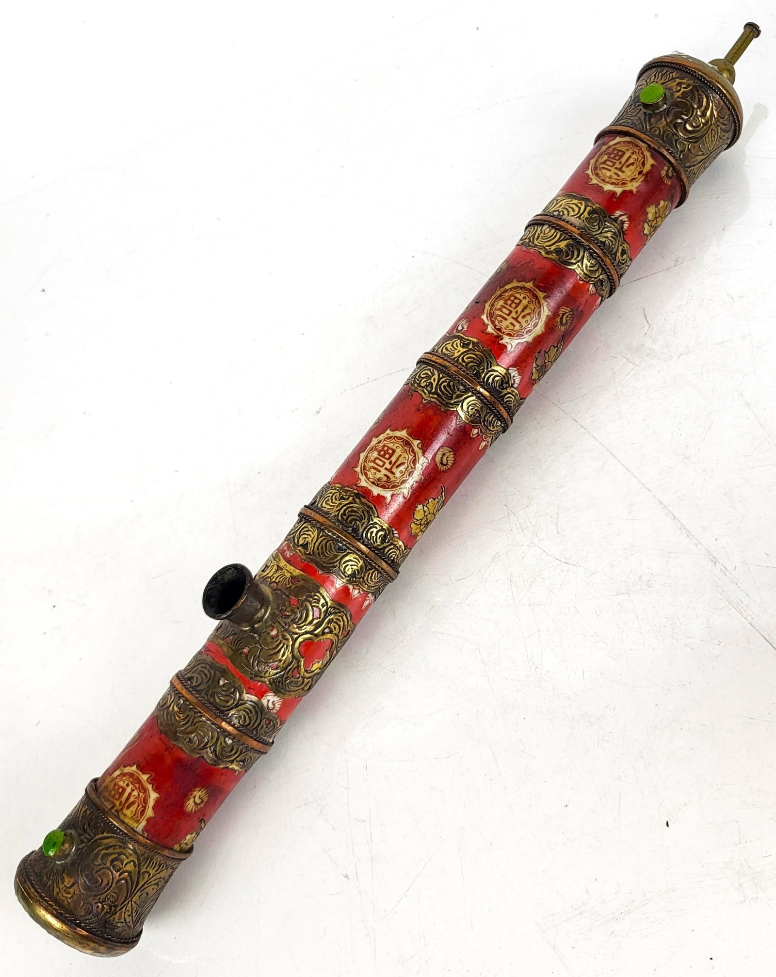 Chinese Porcelain and Brass Pipe: Early 20th century Chinese metal and porcelain opium pipe. [17" L x 1 3/4" W x 2 1/4" D]. In overall good condition, with fading commensurate with age. Condition reports and requests for additional ph