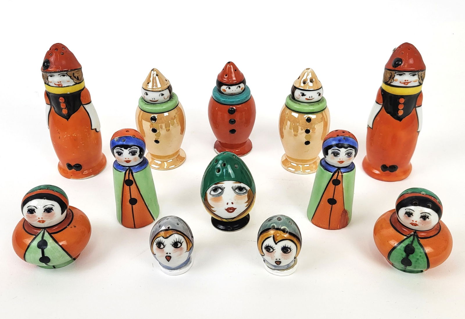 Noritake Art Deco Porcelain Shakers, 12: Group of Noritake Art Deco shakers, circa 1920s, including five sets and two single shakers. Largest: 4" H x 1.5" W x 1.25" D.