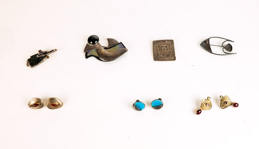 Collection of Modernist Jewelry: Collection of sterling silver modernist jewelry comprising Julie Howison maze brooch, Susan Maria bird brooch, Dey fish brooch, 3 pair of earrings, and a crystal pendant, marks to backs. [Bird brooch: