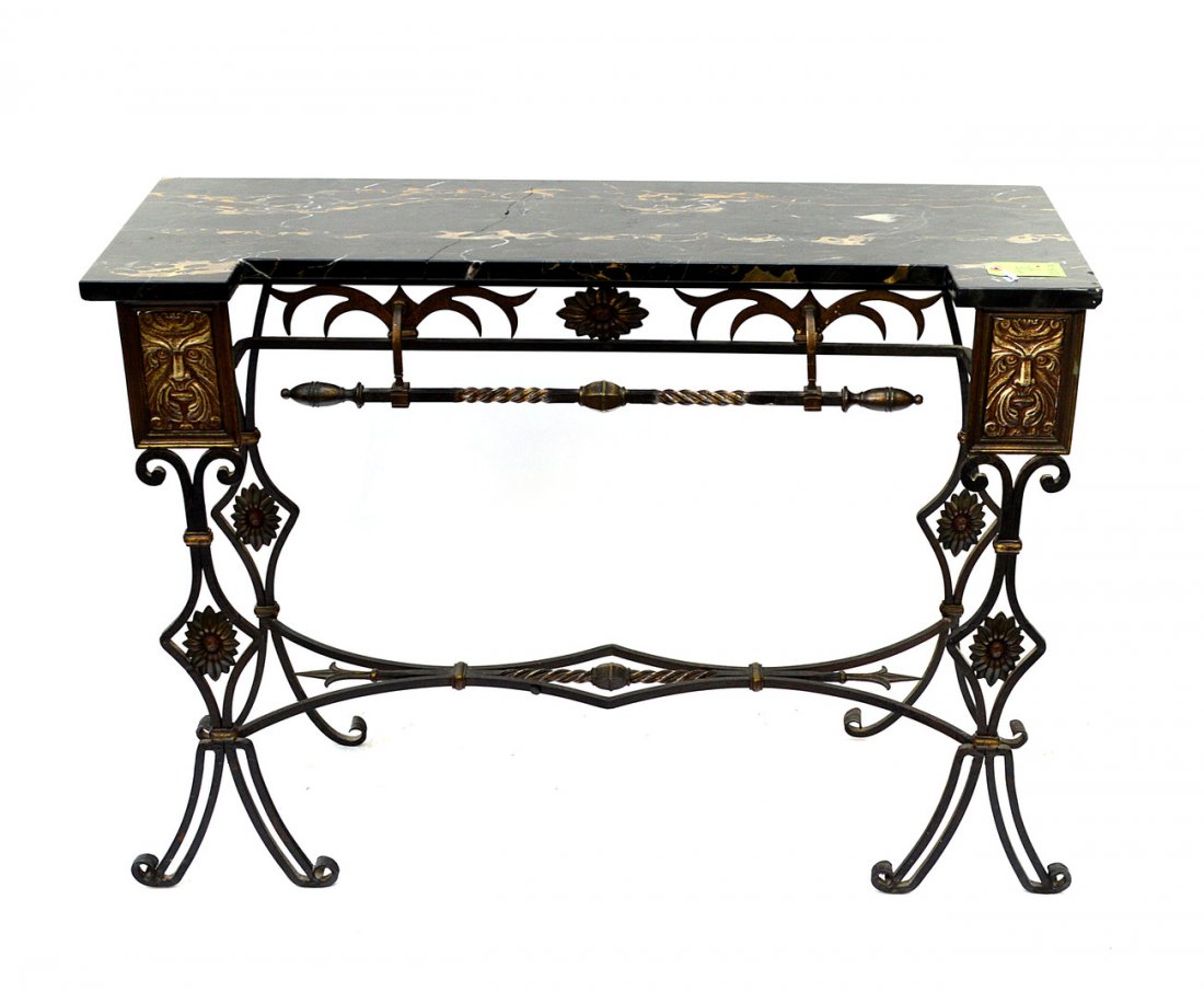 Iron and Marble Top Console: Strap-work style base with grotesque mask accents. Some pitting, cracks, and previous repair to marble top. 42 1/2" W x 14 1/2" D x 32".