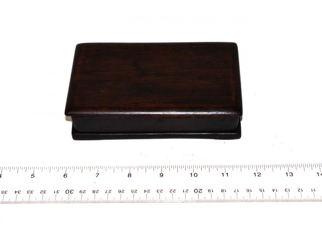 Chinese Ink Stone: Rectangular ink stone with carved low-relief depiction of two seated bulls at top. 3 1/2" x 5 1/2" x 3/4"H. Accompanied by Hali top and bottom covers.