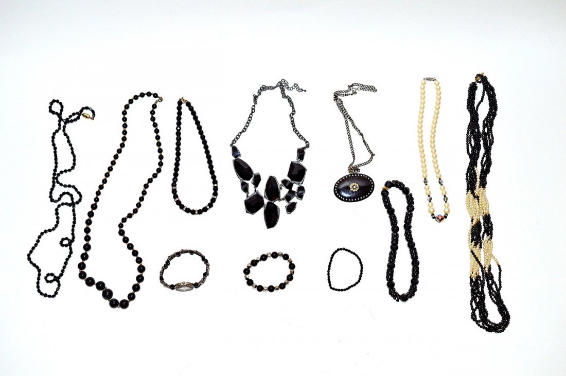 Noir Modern Costume Jewelry: 17 items total, comprising: eight necklaces, two bracelets, and a watch. Includes glass and acrylic beads,faux pearl and paste stones. 11 items total.
