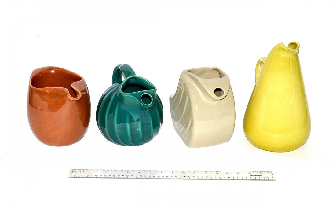 Four Pottery Pitchers [2 Russel Wright]: Yellow, tan, turquoise, and beige. 10 1/2" H [tallest]