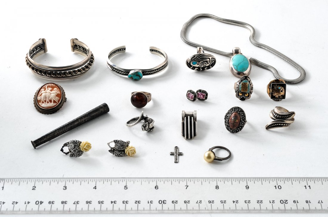 Assorted Sterling and .800 Silver Jewelry: Comprises: a necklace, two bracelets, eight rings, two pendants, a pin, two pair of earrings, and a cigarette holder. Includes: turquoise, amber, and pink stone elements. 6.365 ozt inclusive.