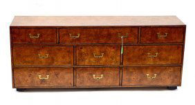 John Widdicomb Sideboard: Burl walnut sideboard, nine drawers, campaign style hardware, losses. 76" L x 19 1/4" D x 31 1/2" H.