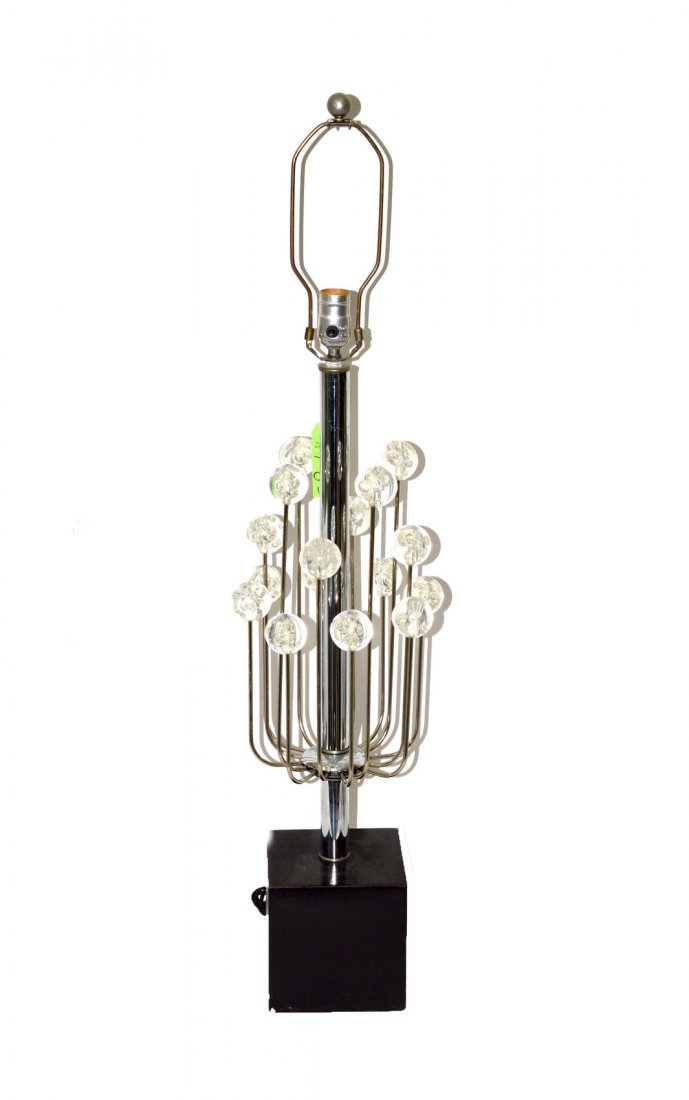Modern Chrome & Lucite Table Lamp: Features a straight shaft surrounded by 16 rays terminating in clear lucite balls with inclusive air bubbles. 7 1/2" DIA x 31 1/2" High to socket.