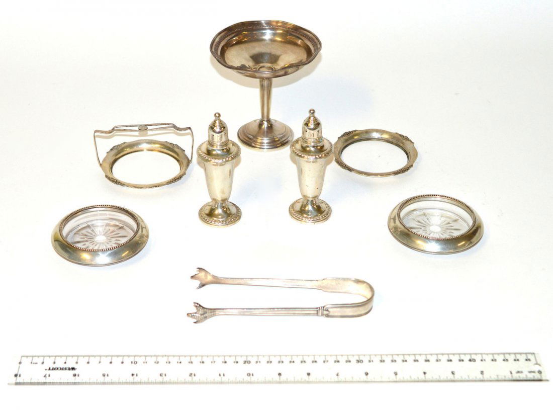 Assorted Sterling Silver Articles: Comprises: a pair of weighted shakers, weighted footed dish, tongs, pair of bottle coasters, and two mounts for a condiment vessel. Weighable: 4.28 ozt.