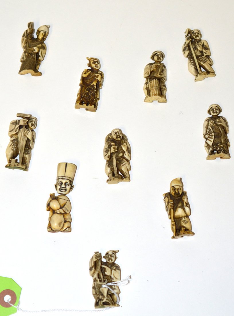 Netsuke Group: Comprises figures including scholars, Buddhist deities, and various traditional occupations. 20 items total. Heights vary from 1 1/4" to 2 3/8". Wear and some chips.