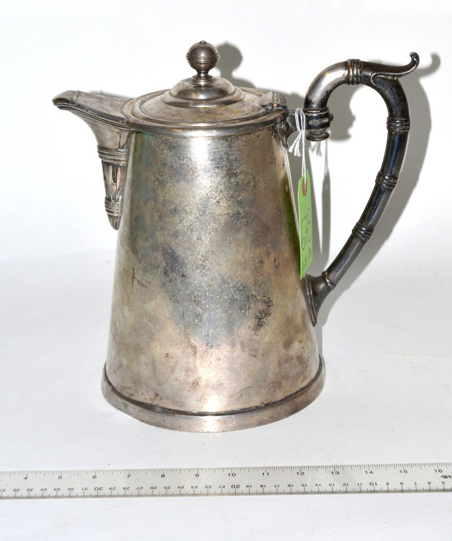 Christofle Silver Plate Coffee Pot: Bears faux bamboo handle, hinged spout, and stepped dome lid with ball finial. 7 1/2" dia. at base. 11 1/2"W x 7 1/2"D x 10 7/8"H. Wear and shallow dents, otherwise complete.