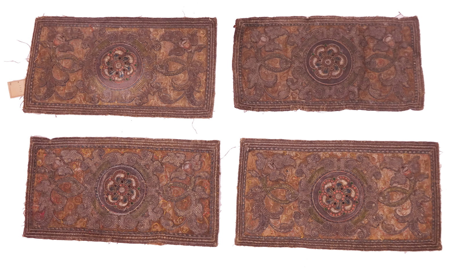 Set of 4 Renaissance Embroidered Apparels: A set of four Renaissance embroidered apparels, densely embroidered with silk, silver, and glass stones, with a pattern of medallions surrounded by scroll work, fruits, and acanthus, circa 1600. [Larg