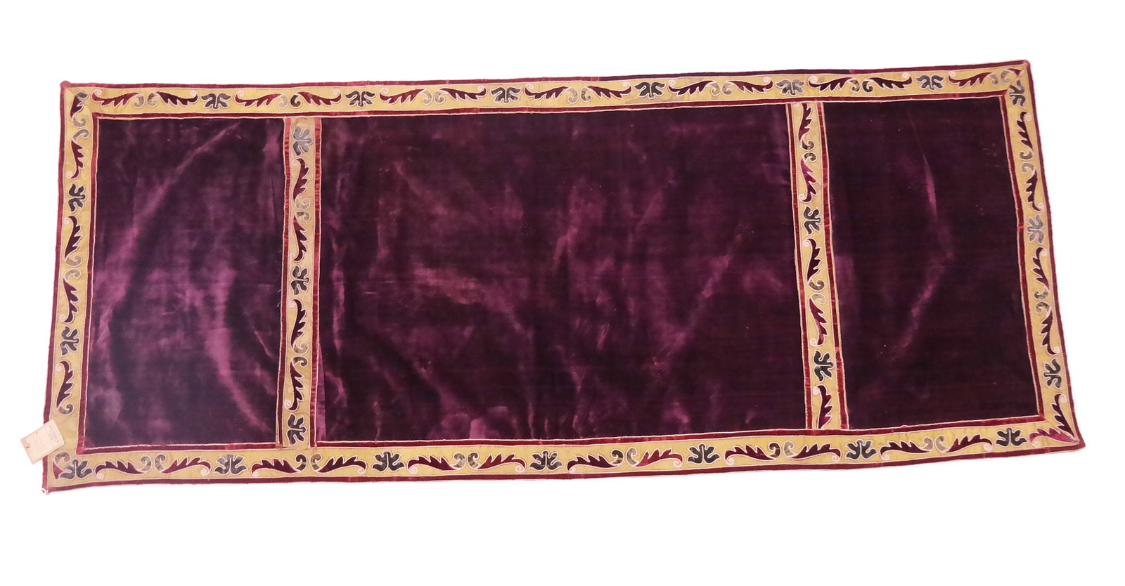Continental 17th C. Embroidered Velvet Cover: A Continental 17th Century cover having silk velvet appliques embroidered on a dark purple silk velvet, lined in modern cotton. [25.5" H x 62.25" W]. Good condition, minor soiling.