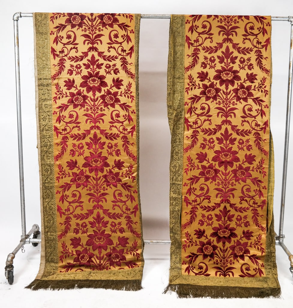 Pair of 19th C. French Silk Velvet Hangings: A pair of 19th Century French hangings having two joint panels of wine red and yellow cut and uncut silk velvet, trimmed with wide silver and gold ribbon. [113" H x 51" W]. One in very good condition.