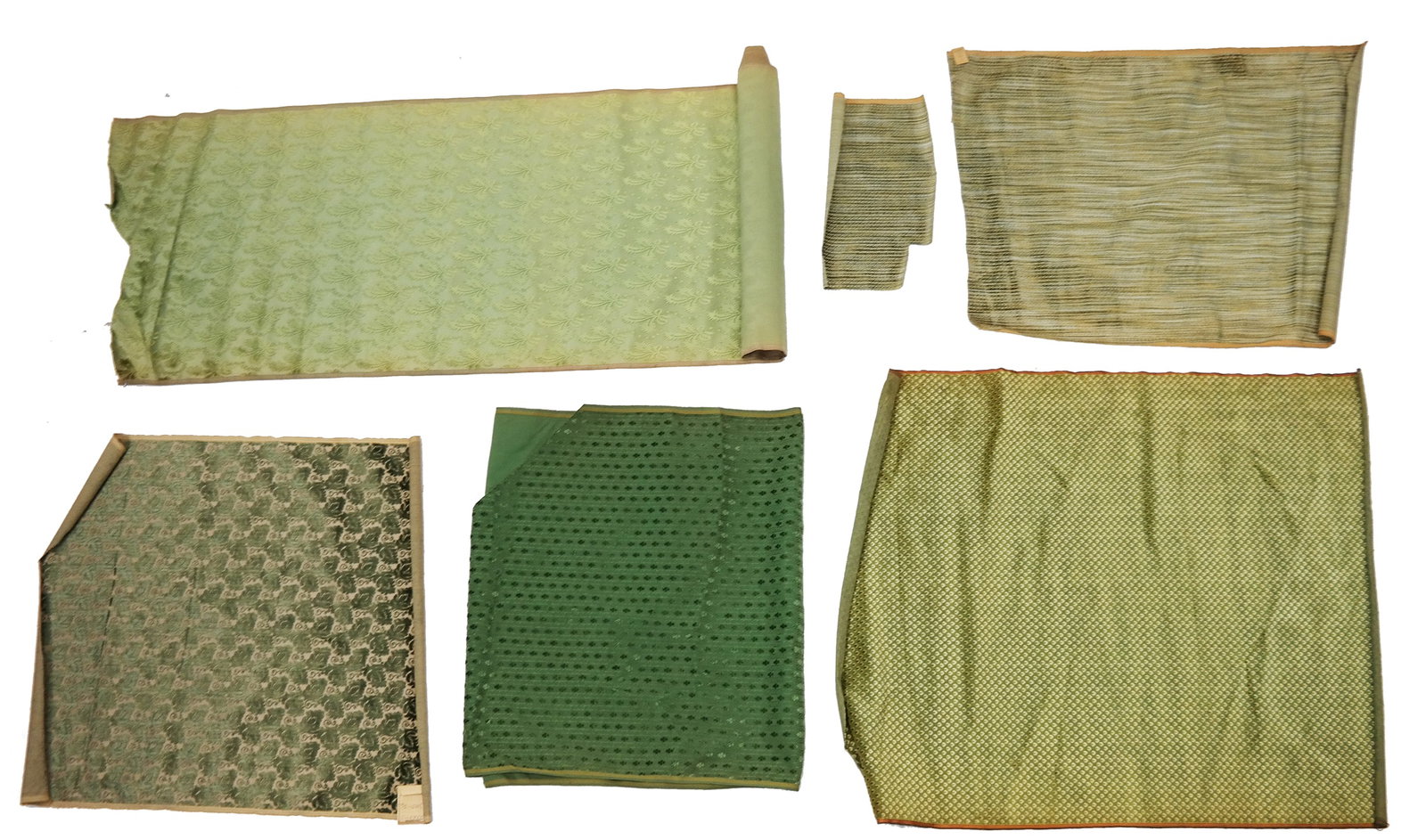 Group of 6 Green Silk Velvet Yardage: A group of six green silk velvet yardage, including: a bolt of cut and uncut cannele velvet with feathers and ribbons, two lengths of small pattern silk velvet, a 17th Century style cut velvet, and a 