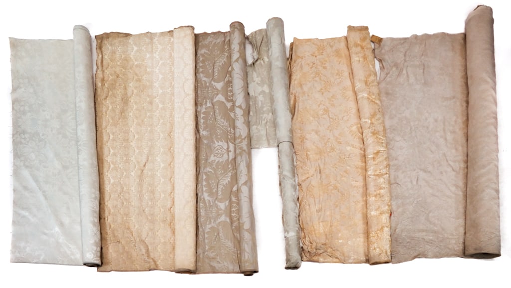 6 Bolts of 18th C. Style Silk & Cotton Damask: A group of six bolts of 18th Century style cream silk and cotton damasks circa 1920's-1930's, including: five bolts with traditional florals, together with a 1920's/1930's modernist floral patterned c