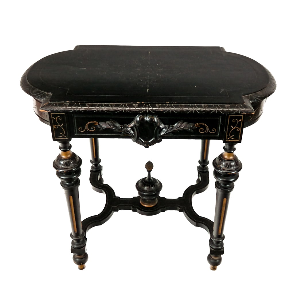 Eastlake Victorian Ebony Table: Late 19th century incised table with a stretcher and finial. [30.5" H x 35" x 23" D]. Condition reports and requests for additional photos cannot be accepted on this lot; please bid accordingly. This 