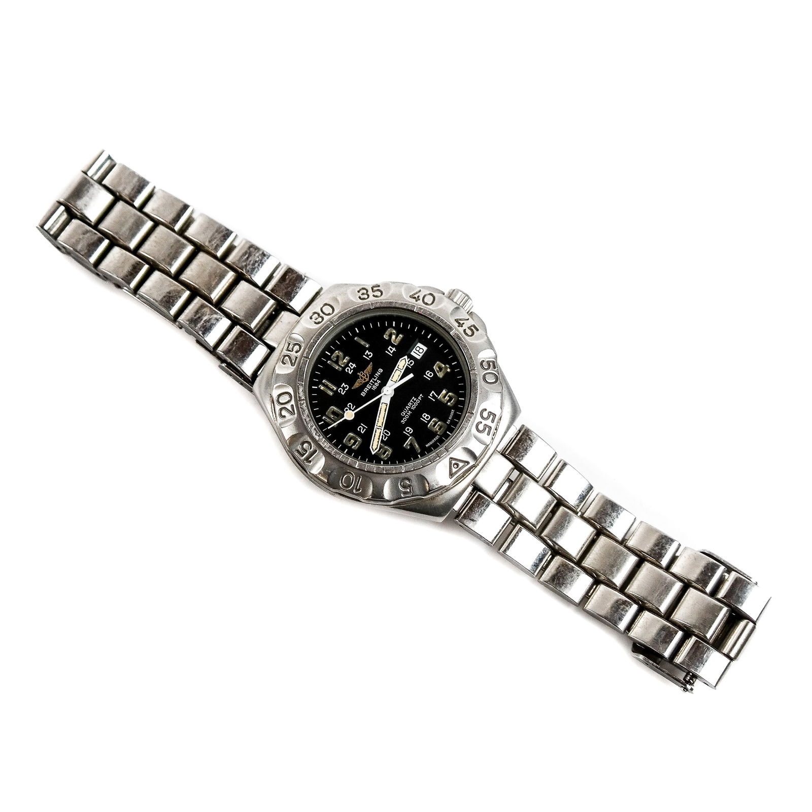 Breitling Military A50036 Quartz Wristwatch: A Breitling Military A50036 stainless steel wristwatch having quartz movement, a black date dial, and a steel band, 26mm face diameter, M50036 3831. In good condition with minimal wear. Not tested.