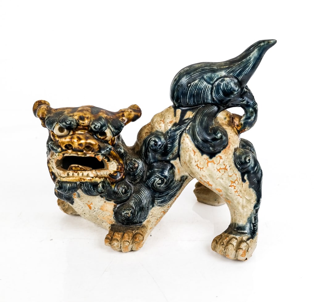 Chinese Ceramic Foo Dog: Chinese ceramic decorated Foo Dog, likely Qing Dynasty. [6.75" H x 8" W x 6" D]. Overall good condition with a crack to the rear front leg and some cracking at front likely from production.