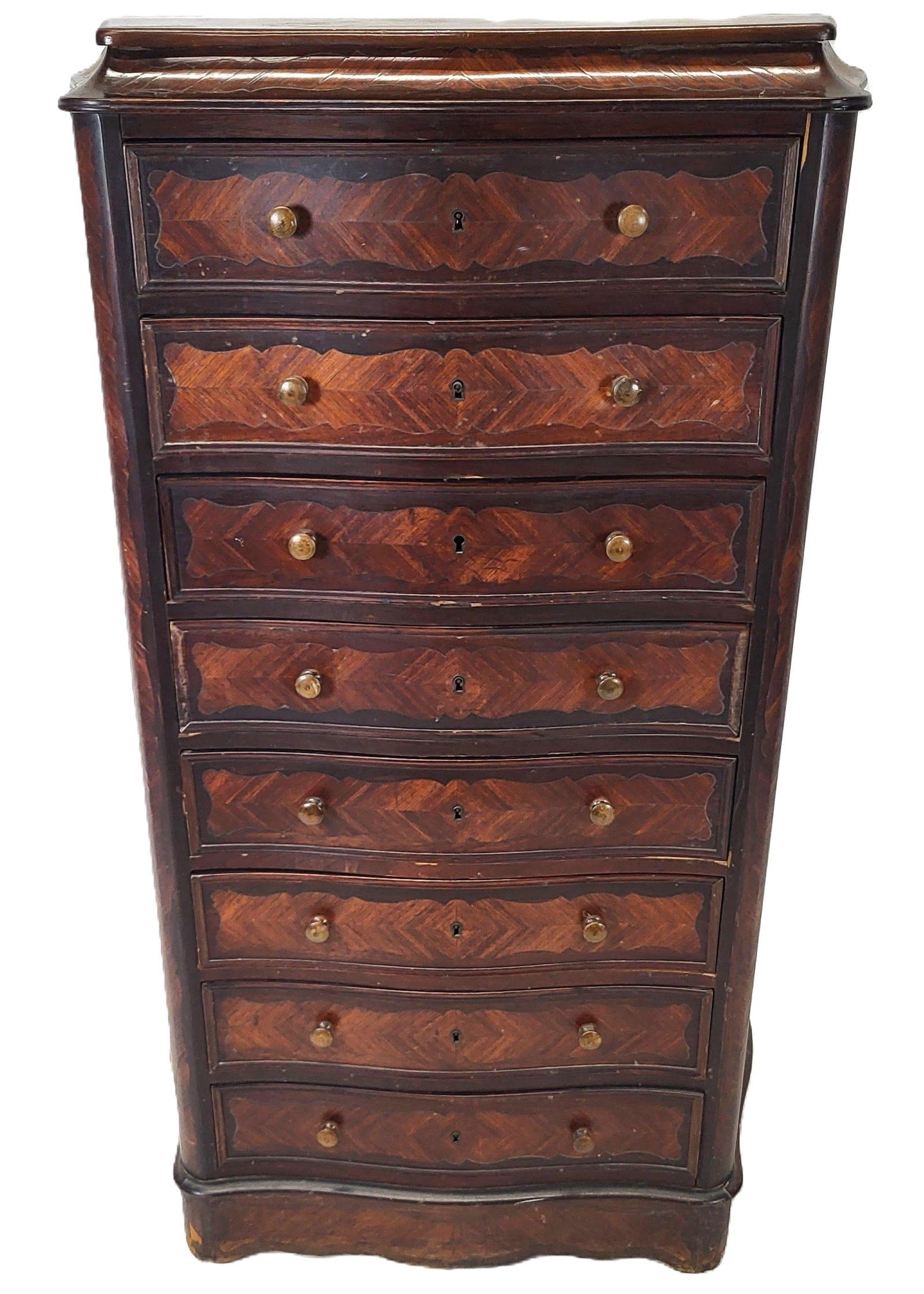 Louis Philippe Eight Drawer Chest: Louis Philippe eight drawer chest with marquetry inlay, late 19th/early 20th century [52.5" H x 30" W x 13" D]. Overall good to fair condition with scattered losses and lifting to veneer.