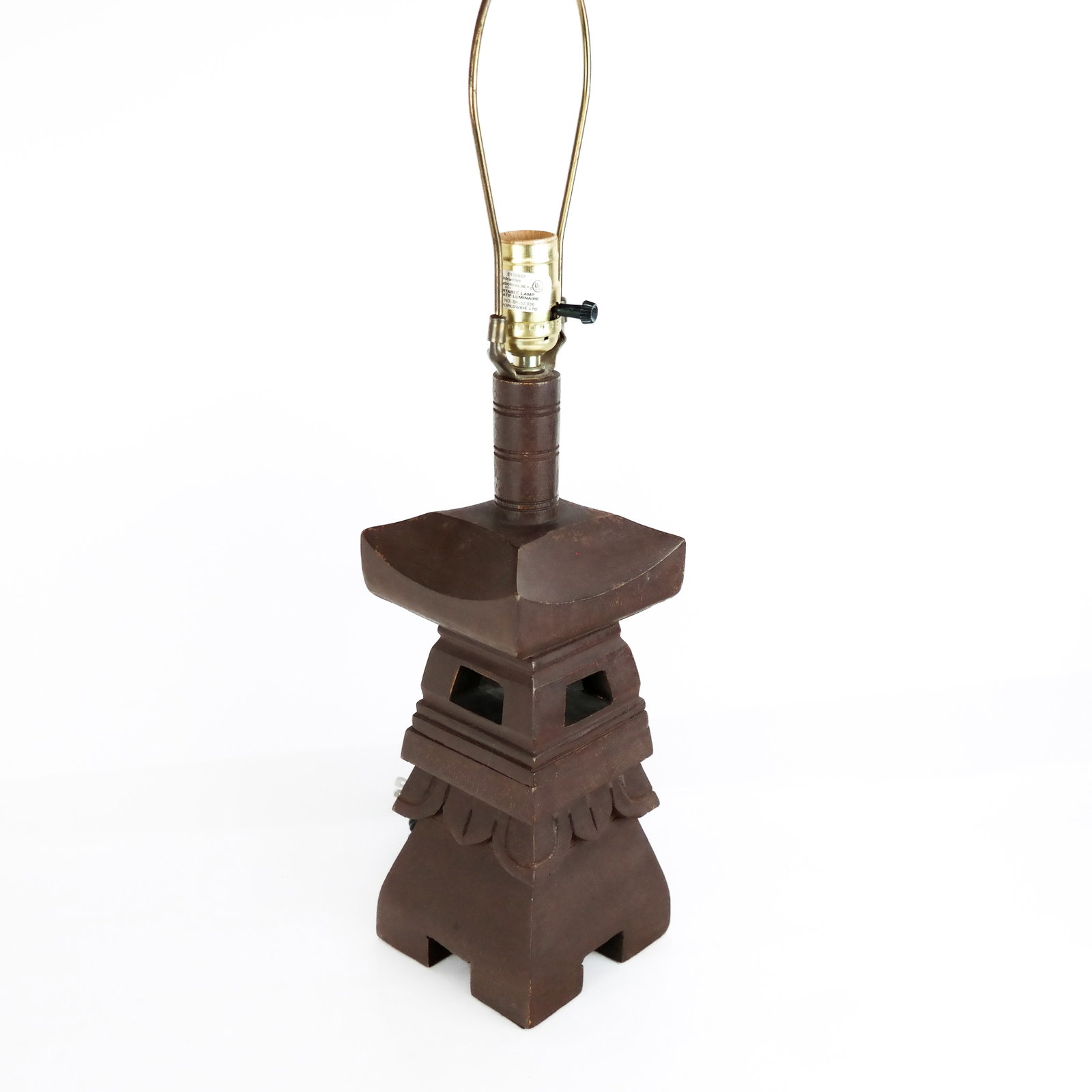 Chinese Carved Wood Table Lamp: Chinese carved wood table lamp modeled as a pagoda. [24" H x 5" W x 5" D]. Losses and wear. Condition reports and requests for additional photos cannot be accepted on this lot, please bid accordingly.