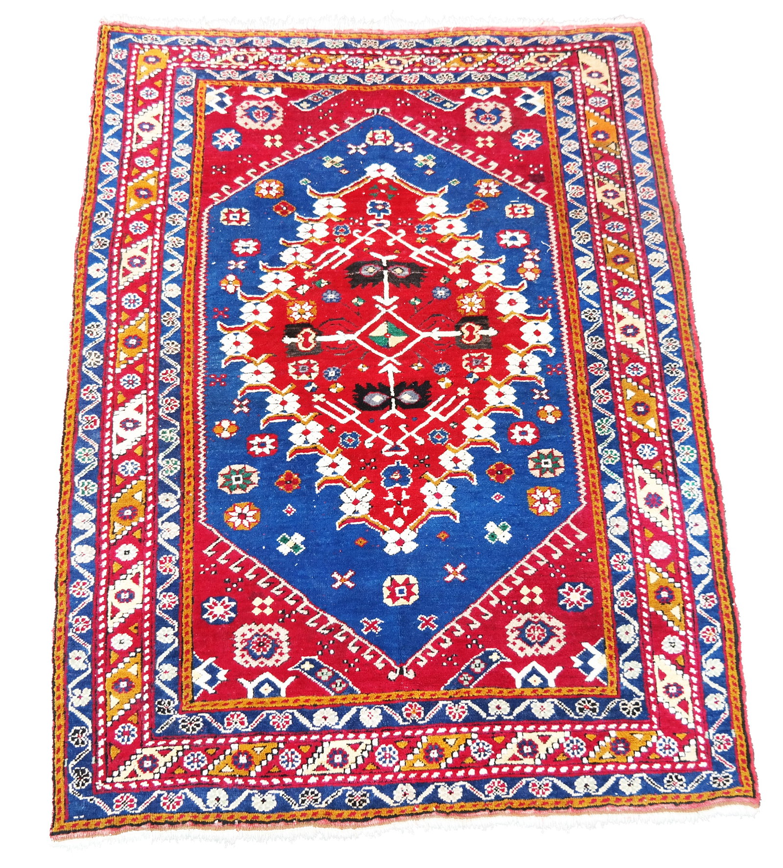 Kazak Area Rug: Kazak area rug with a red center medallion. [64" x 48"]. In overall good condition.