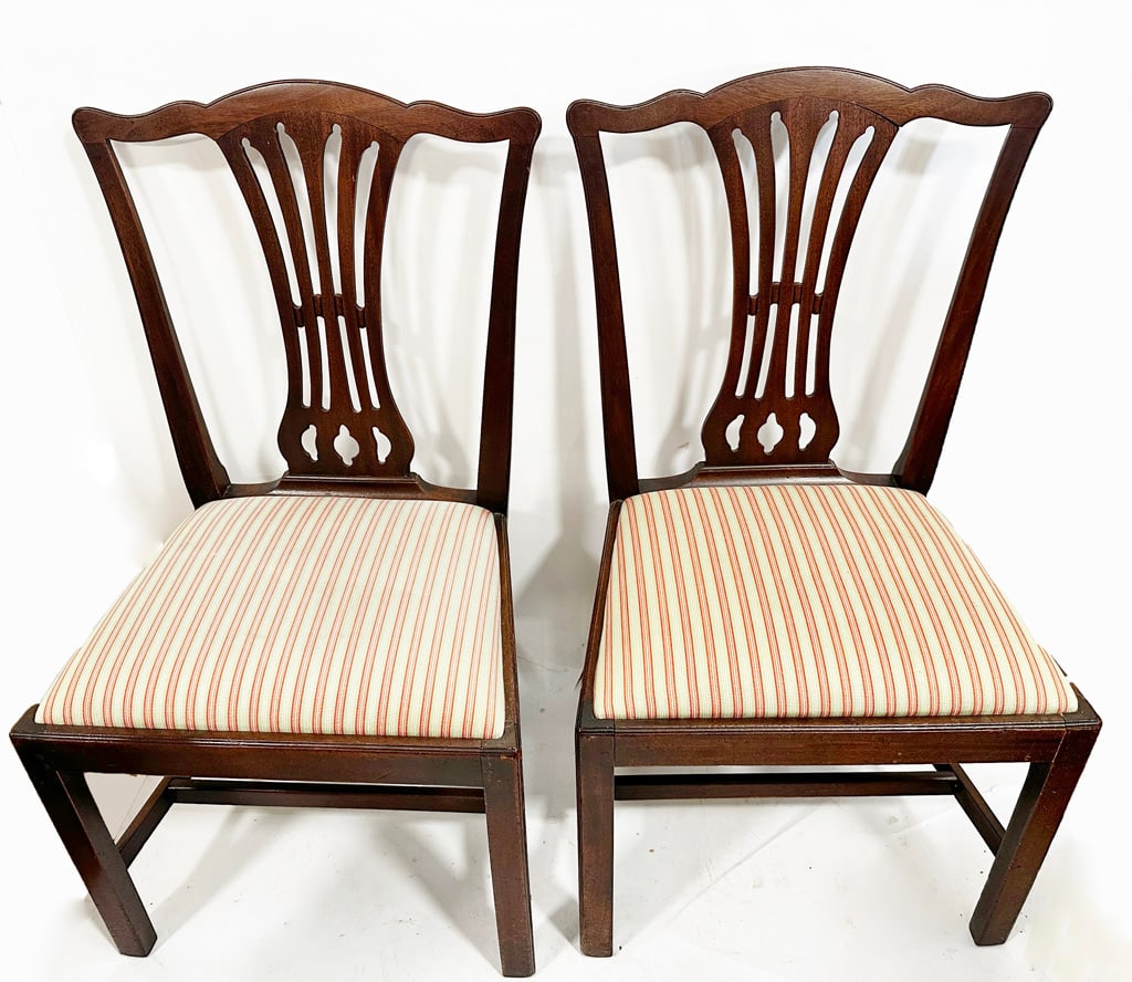 Pair of English 19th C. Chippendale Chairs: Pair of antique English 19th century carved mahogany Chippendale chairs with upholstered seats. [37.5" H x 21.5" W x 20" D; 18.5" H to seat]. Worn, with repairs. Condition reports and requests for add