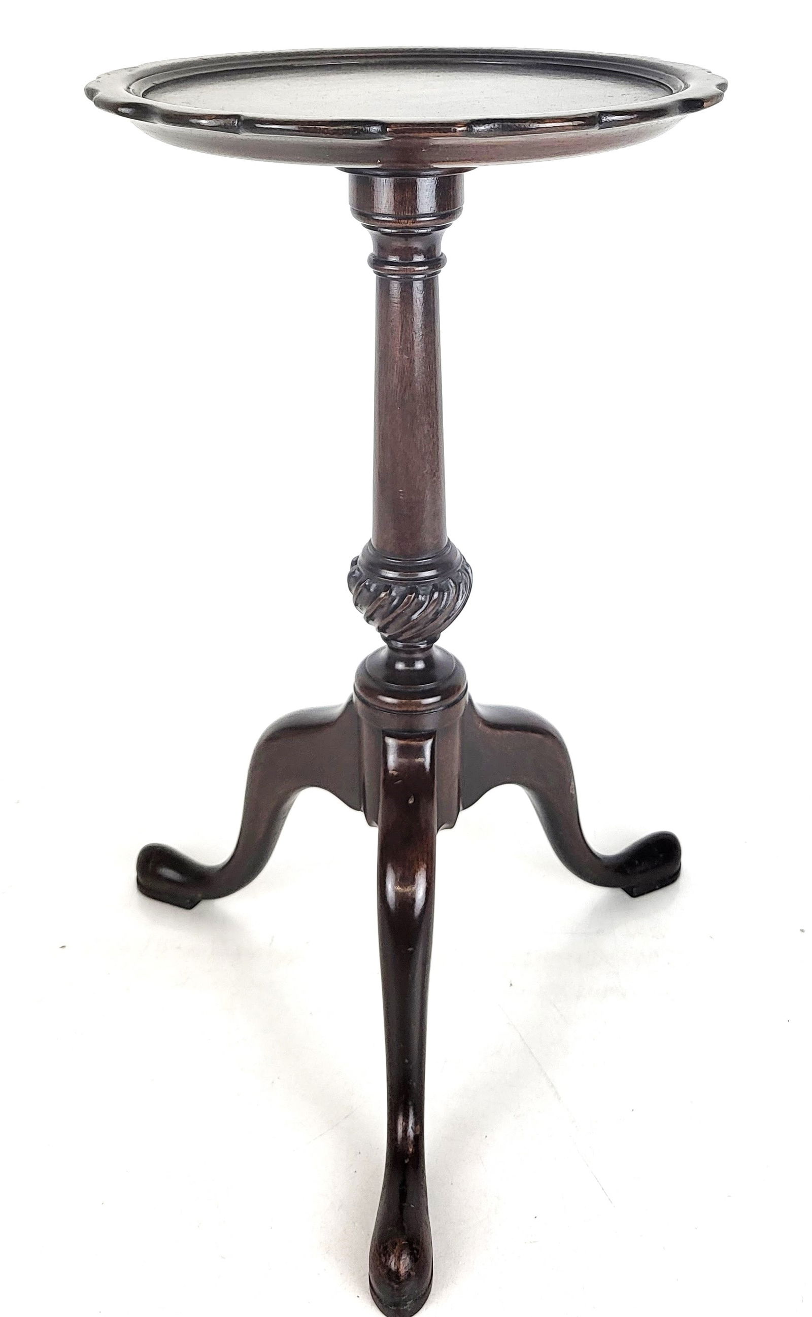 Carved Mahogany Candle Table: Carved mahogany candle table on a tripod base with a pie crust edge. [18" H x 11.5" Diameter]. Overall good condition.
