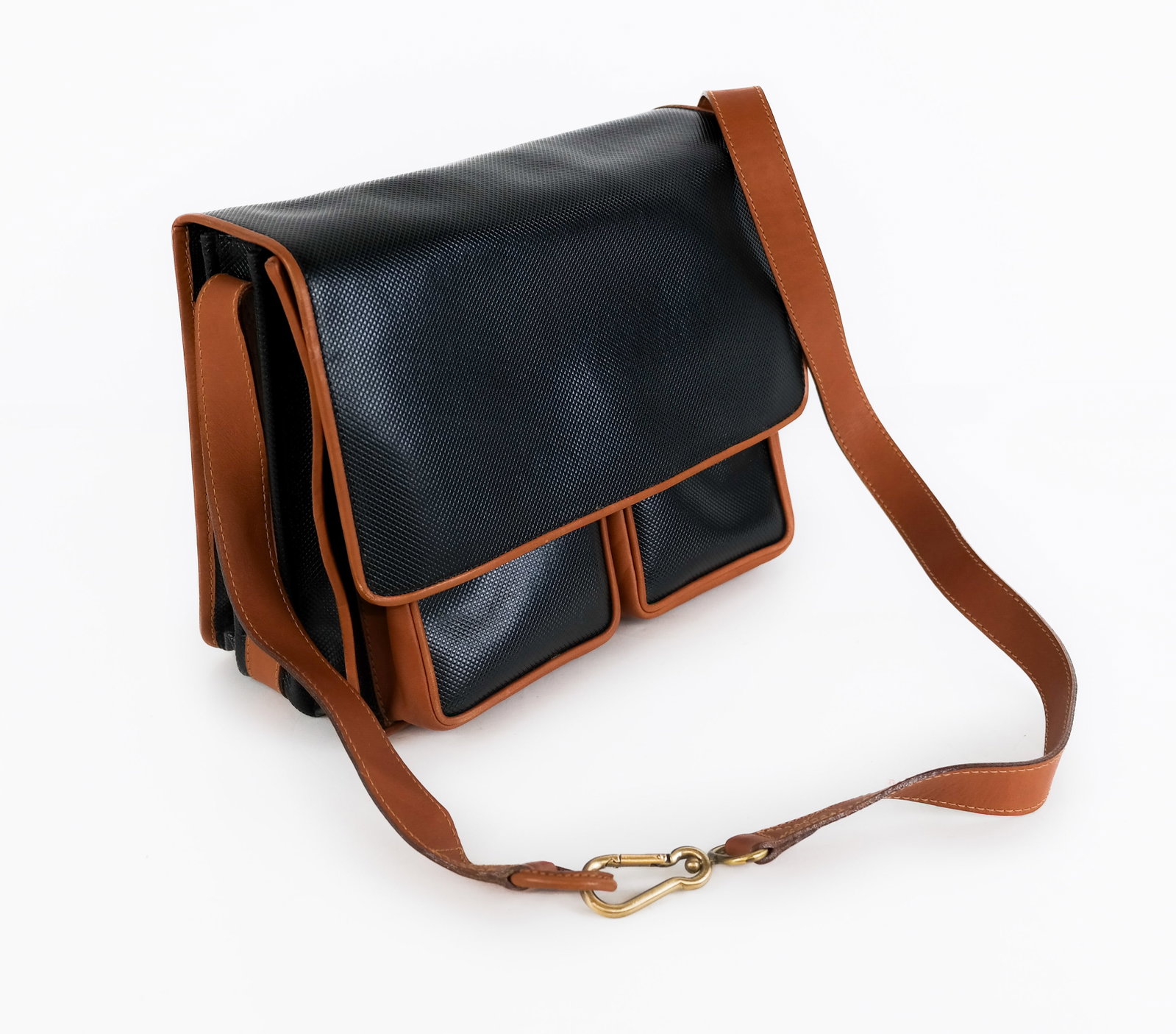 Bottega Veneta Cross Body Bag: Bottega Veneta, Italian, cross body bag in black with brown leather accents, marked Bottega Veneta to interior. [9" H x 11" W x 4" D]. Overall good condition.