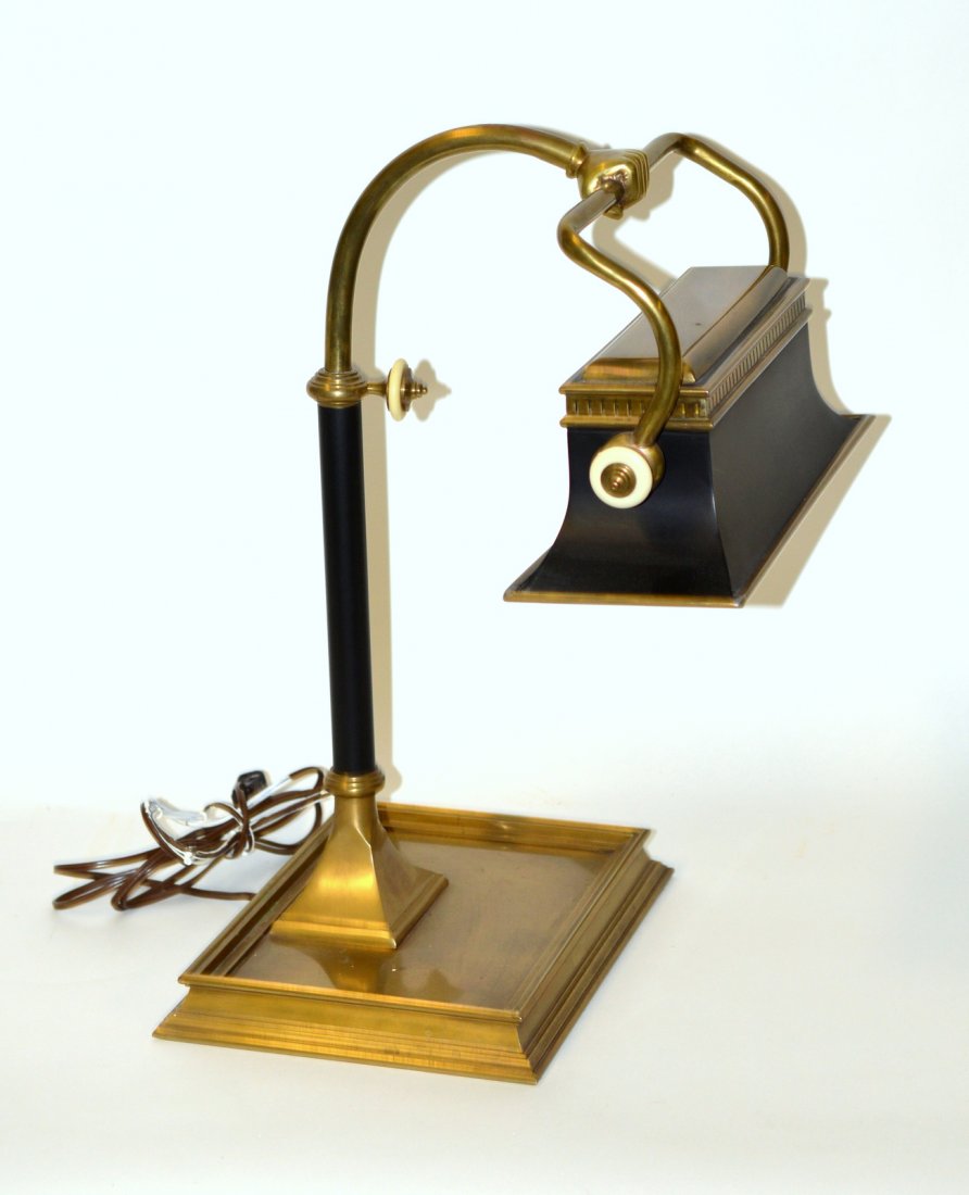 Brass & Tole Banker's Lamp: Features faux ivory accents, flared shape and hand-form support. Bears a single edison base socket. In good condition. 13 1/4"W x 12 1/2"D x 20"H.