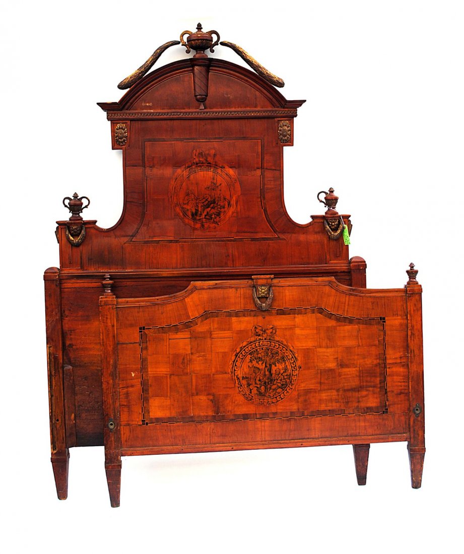 Antique Austrian Style Bed Frame: Antique Austrian style bed frame without rails. Having parcel gilt carved wood and gesso accents. Painted centre medallion on headboard and footboard. Warping and cracking to wood. Losses, scratches t