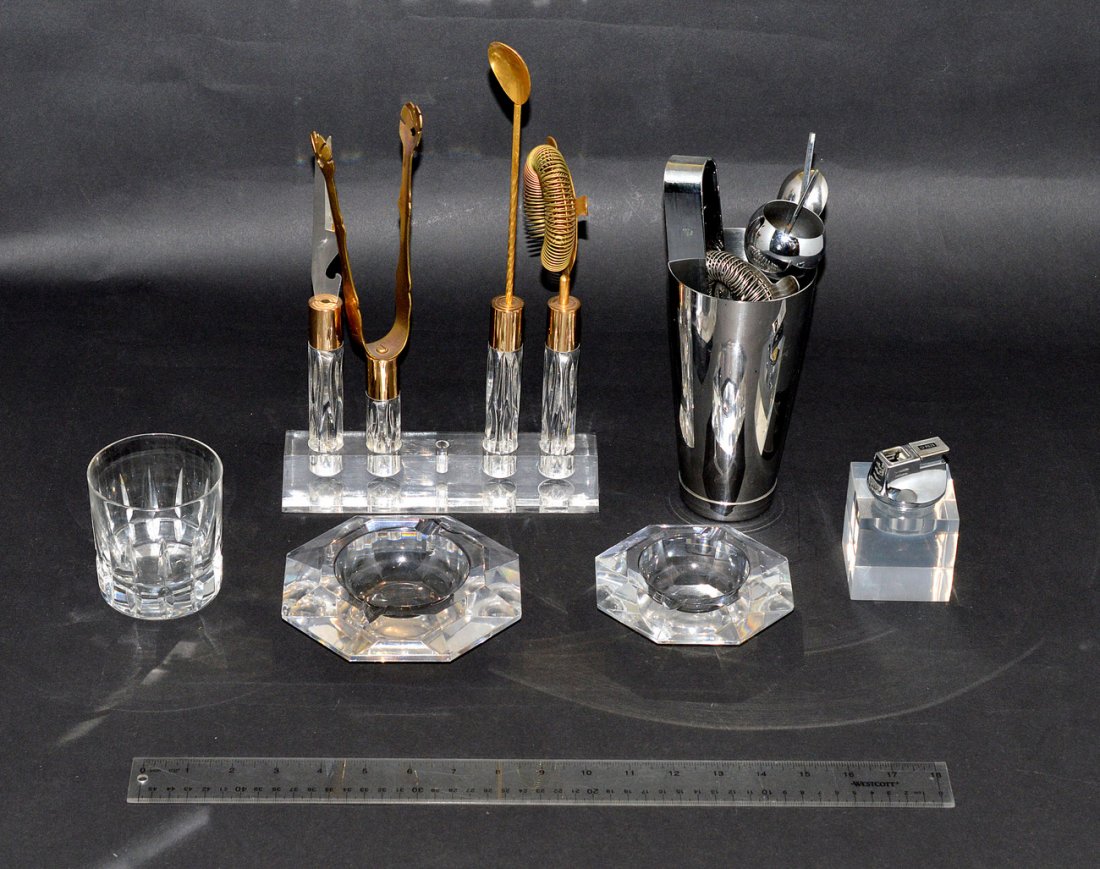 Assorted Modern Barware: Comprises a gold-tone four piece utensil set with Lucite handles, two octagonal Val St. Lambert ash receivers, a "Piezo" Lucite and chrome lighter and a crystal tumbler signed: "Atlantis" on bottom. A