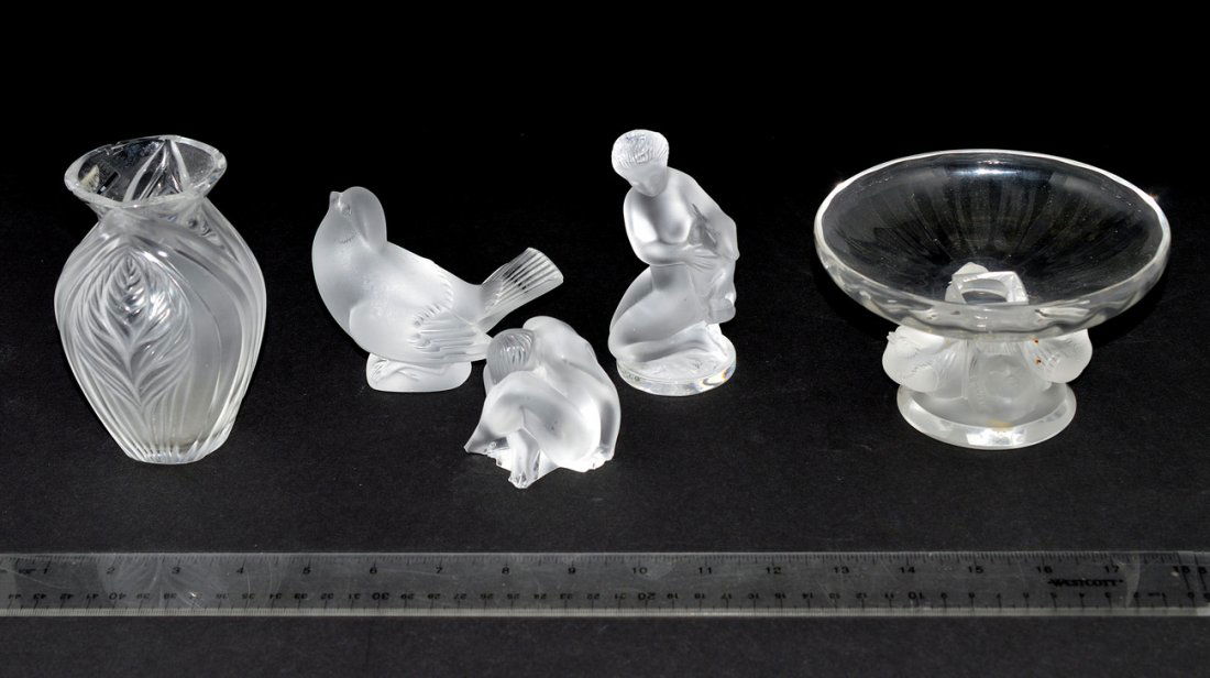 Five Assorted Decorative Lalique Glass Articles: Comprises: 1.) A footed dish with four swallow base [5 5/8" Dia x 3 3/8" H. 2.) Vase with leafy motif [5" H], bears multiple chips on mount. 3.) Swallow figure [3 3/8" H]. Chip on tail feathers. 4.) W