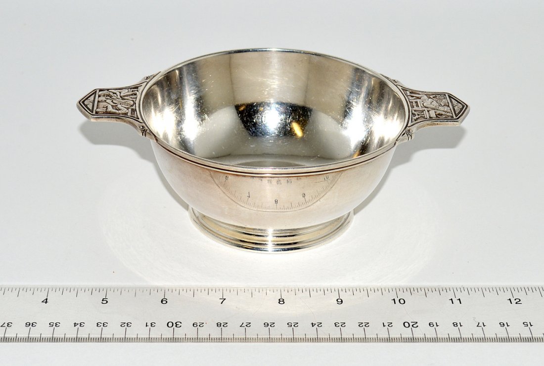 Tiffany & Co. Makers Sterling Silver Bowl: Bears handles with low relief scenes depicting a king smoking a pipe and a group of three musicians. 7 1/4"W x 4 7/8"D x 2 1/4"H. 8.95 ozt total.