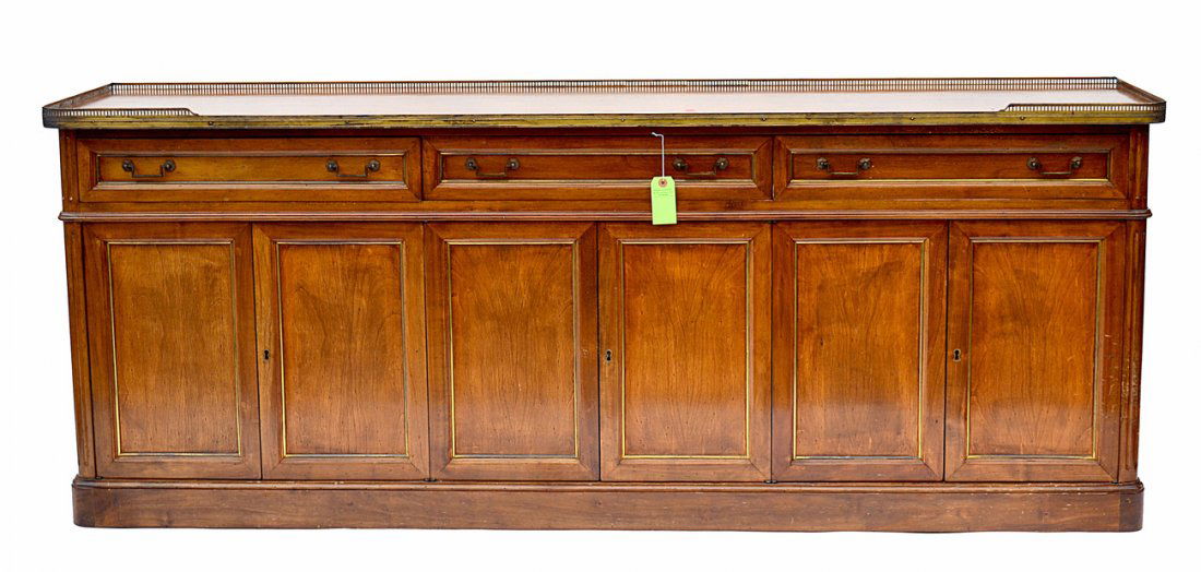 Walnut Credenza: Walnut six-door, three-drawer credenza with a reticulated gallery. 789"L x 19"D x 31"H. Worn.